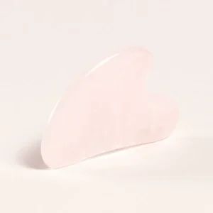 Gua sha de cuarzo rosa natural para masaje facial relajante